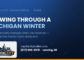 Snow blowing across a dark road at night — a guide to winter towing in Michigan from Capital City Trailer Rental in Lansing